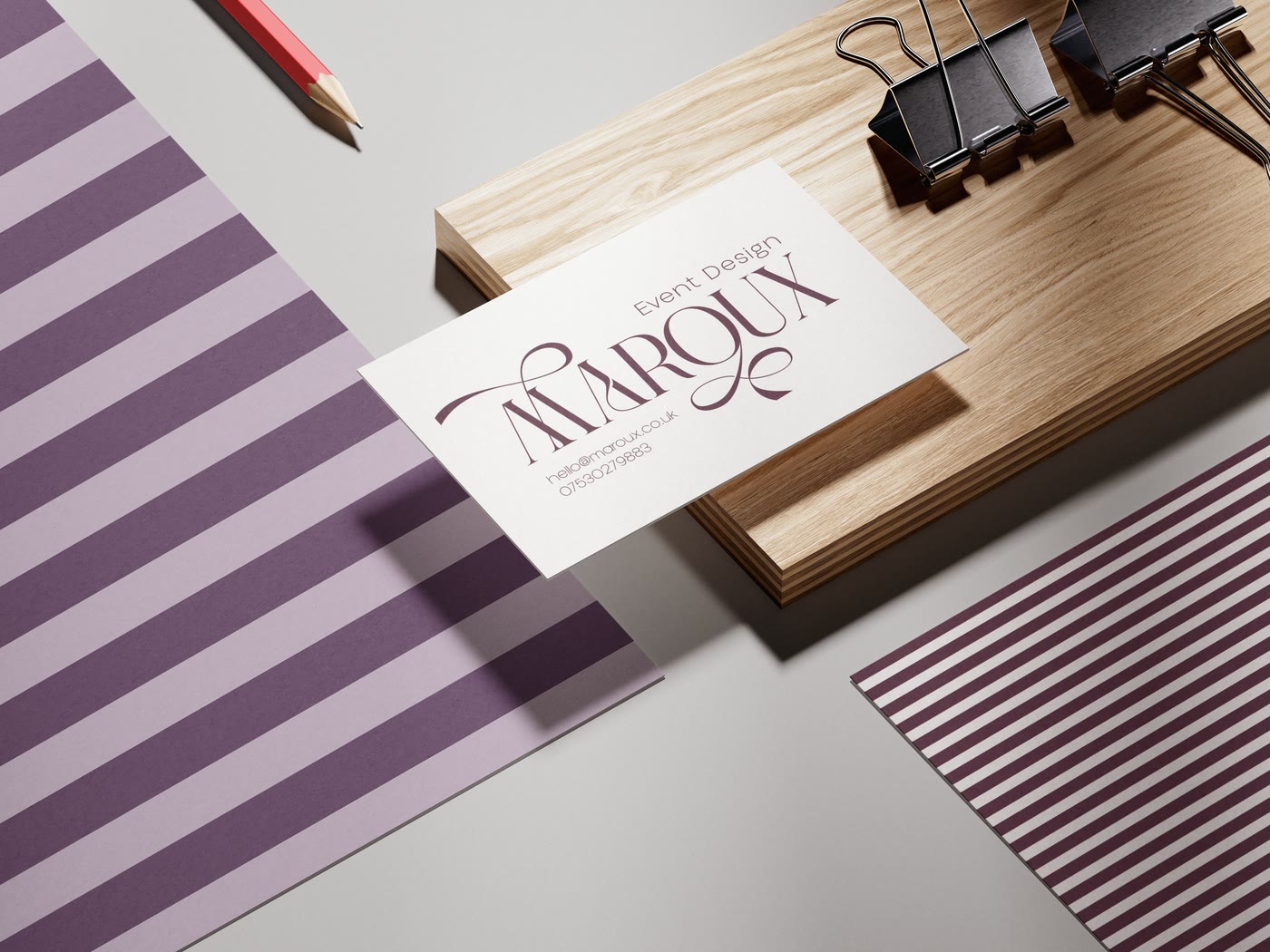 A business card on striped paper