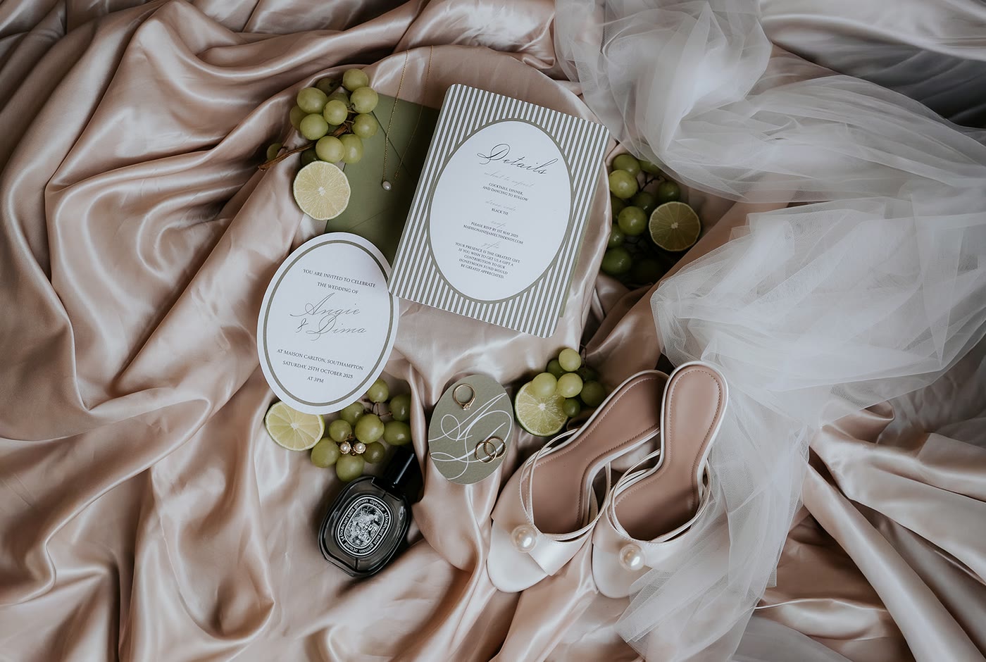 Invitations laid out on satin